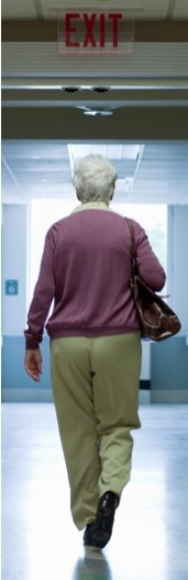 Senior woman walking hospital hallways