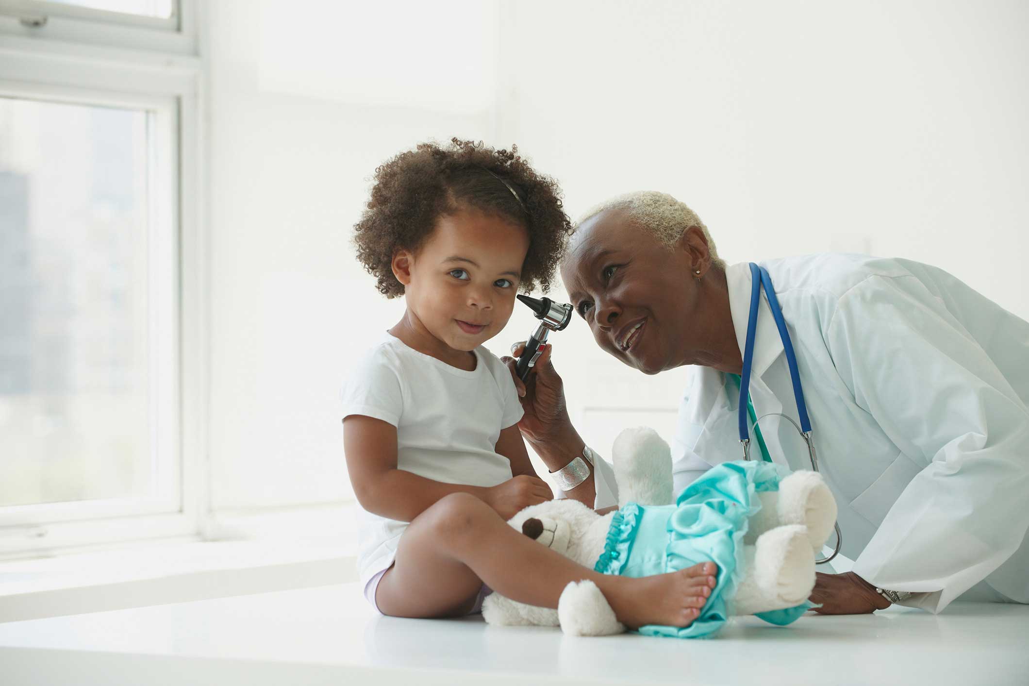 Toddler Girl and doctor doing a checkup